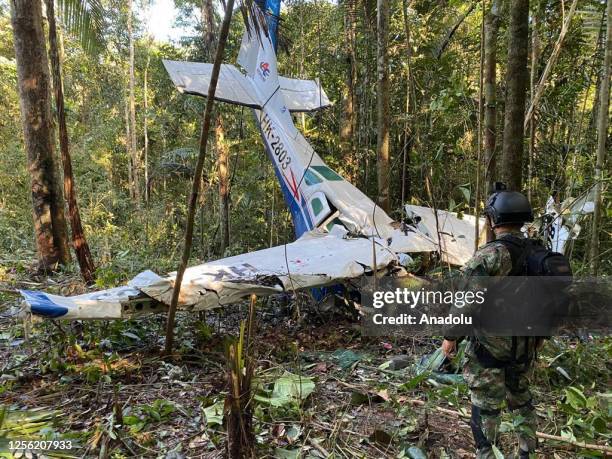 Search and rescue teams of Colombian Army conduct operation at the scene after a plane crashed in the jungle more than two weeks ago in Colombia on...