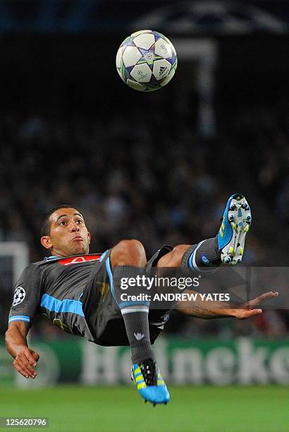 Napoli's Uruguayan midfielder Walter Gargano clears the ball during the UEFA Champions League group A football match between Manchester City and...