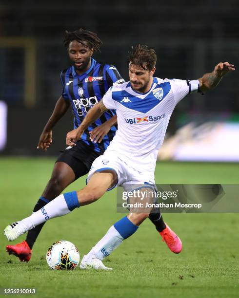 Adrien Tameze of Atalanta controls the ball against Daniele Dessena of Brescia Calcio during the Serie A match between Atalanta BC and Brescia Calcio...