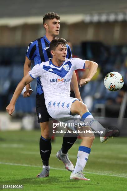 Alessandro Semprini of Brescia Calcio controls the ball against Roberto Piccoli of Atalanta during the Serie A match between Atalanta BC and Brescia...