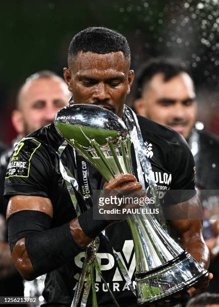 Toulon's Fijian wing Jiuta Wainiqolo celebrates with the trophy after winning the European Challenge Cup rugby union final match between Glasgow...