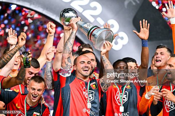 Stefano Sturaro of Genoa lifts the trophy as Genoa are awarded for earning promotion into Serie A after the Serie B match between Genoa CFC and Bari...