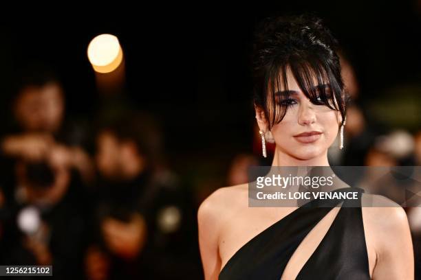 British singer and model Dua Lipa arrives for the screening of the film "Omar la Fraise" during the 76th edition of the Cannes Film Festival in...