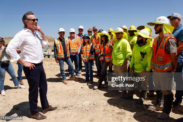 California Governor Gavin Newsom talks with workers from Cupertino Electric, Inc., along the construction of the Battery Energy Storage Systems for...