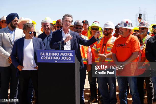 California Governor Gavin Newsom speaks during a press conference surrounded by workers, former Los Angeles Mayor Antonio Villaraigosa , Jim...