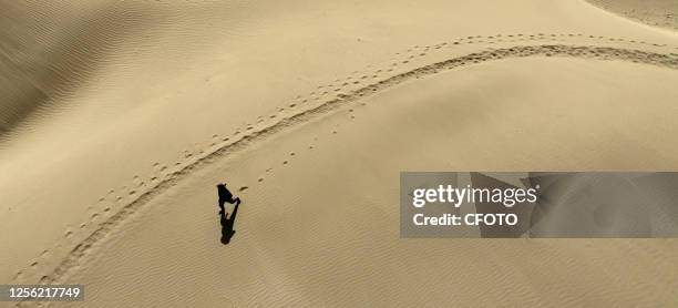 Tourist enjoys themselves at a scenic spot in Bazhou, Xinjiang province, China, May 19, 2023.