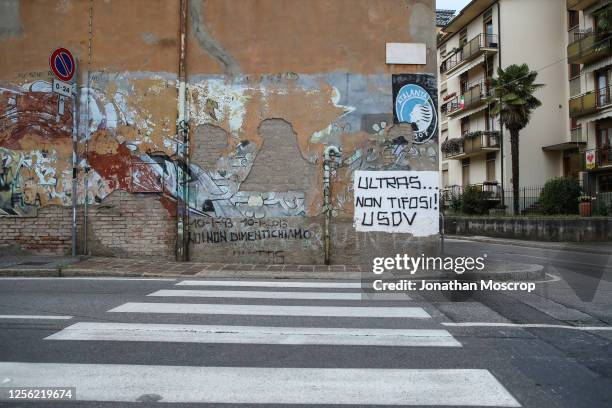 Ultras graffiti and a club crest painted on a building facade outside the ground pictured before the Serie A match between Atalanta BC and Brescia...