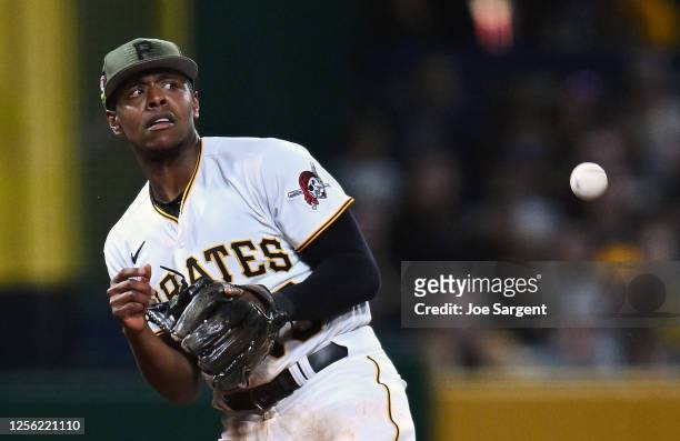 Ke'Bryan Hayes of the Pittsburgh Pirates misplays a ball hit by Geraldo Perdomo of the Arizona Diamondbacks during the seventh inning at PNC Park on...