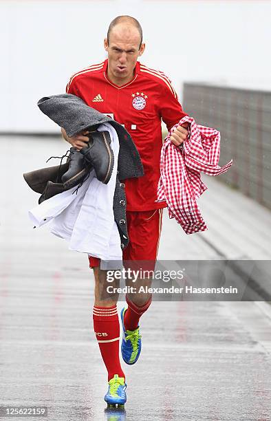 Arjen Robben of FC Bayern Muenchen walks away after the Paulaner photocall at Bayern Muenchen`s trainings ground Saebener Strasse on September 19,...