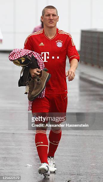 Bastian Schweinsteiger of FC Bayern Muenchen walks away after the Paulaner photocall at Bayern Muenchen`s trainings ground Saebener Strasse on...