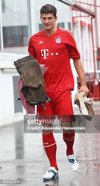 Mario Gomez of FC Bayern Muenchen walks away after the Paulaner photocall at Bayern Muenchen`s trainings ground Saebener Strasse on September 19,...