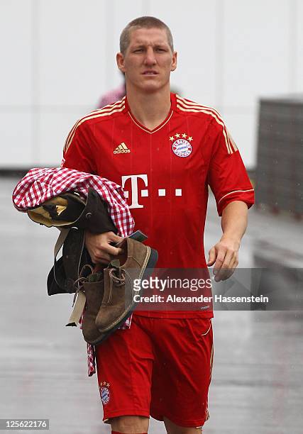 Bastian Schweinsteiger of FC Bayern Muenchen walks away after the Paulaner photocall at Bayern Muenchen`s trainings ground Saebener Strasse on...