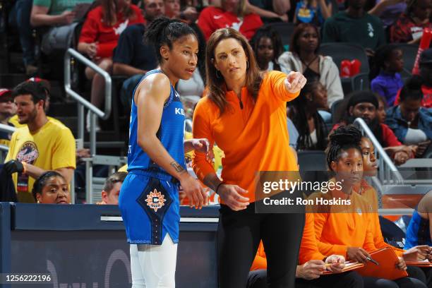 Head Coach Stephanie White speaks with Tyasha Harris of the Connecticut Sun during the game against the Indiana Fever on May 19, 2023 at Gainbridge...