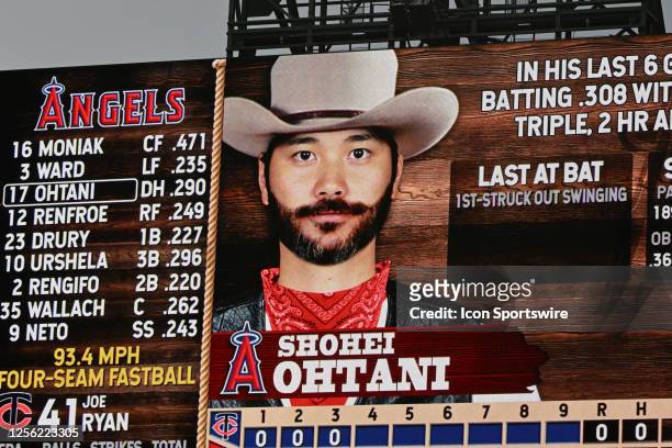 Los Angeles Angels designated hitter Shohei Ohtani with cowboy hat and beard on the right field big screen during country weekend in an MLB baseball...