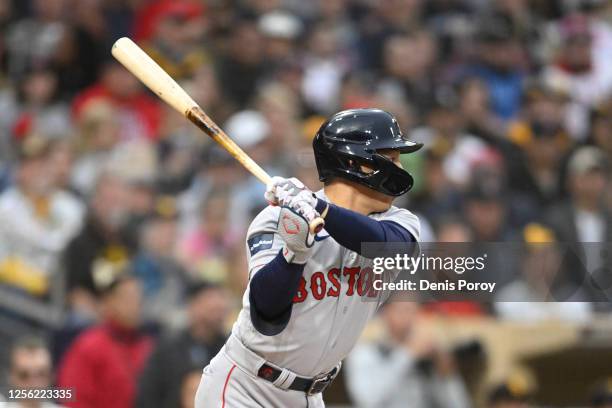 Masataka Yoshida of the Boston Red Sox hits a single during the second inning of a baseball game against the San Diego Padres at Petco Park on May...