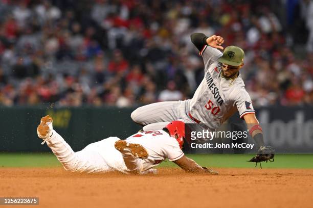 Luis Rengifo of the Los Angeles Angels steals second base as Willi Castro of the Minnesota Twins lost the ball in the fourth inning at Angel Stadium...
