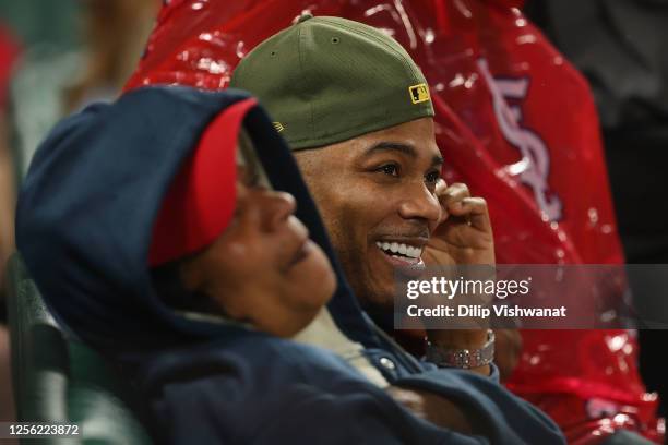 Musician Nelly takes in a game between the St. Louis Cardinals and the Los Angeles Dodgers at Busch Stadium on May19, 2023 in St Louis, Missouri.