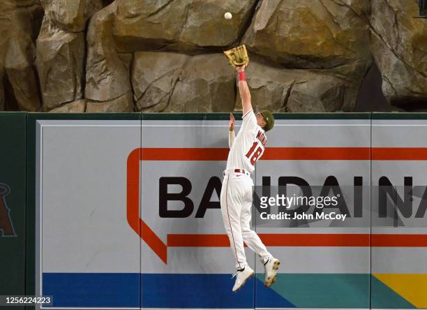 Mickey Moniak of the Los Angeles Angels catches a ball in center field to rob Michael A. Taylor of the Minnesota Twins of a home run in the seventh...