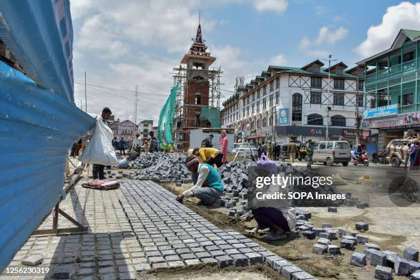 Laborers work at the construction site of the smart city renovation project ahead of the G20 Tourism meeting in Srinagar. From May 22-24 Srinagar...