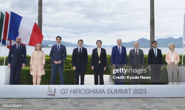 The Group of Seven leaders pose for photos on May 20 the second day of their three-day summit in the western Japan city of Hiroshima. Pictured from...