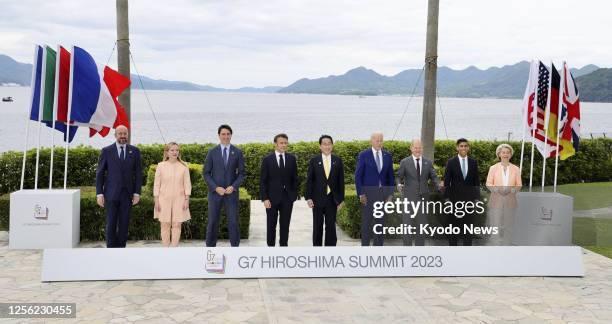The Group of Seven leaders pose for photos on May 20 the second day of their three-day summit in the western Japan city of Hiroshima. Pictured from...