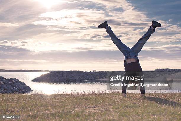 handstand on beach - boy handstand stock pictures, royalty-free photos & images