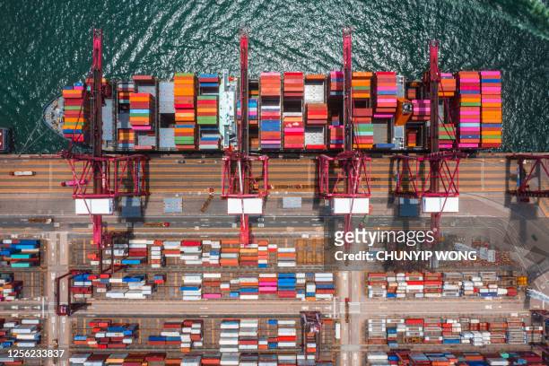 kwai tsing container terminals from drone view - global trade war stock pictures, royalty-free photos & images