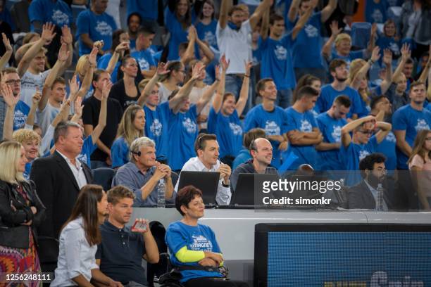basketball commentators and spectators watching match - basketball all access stock pictures, royalty-free photos & images