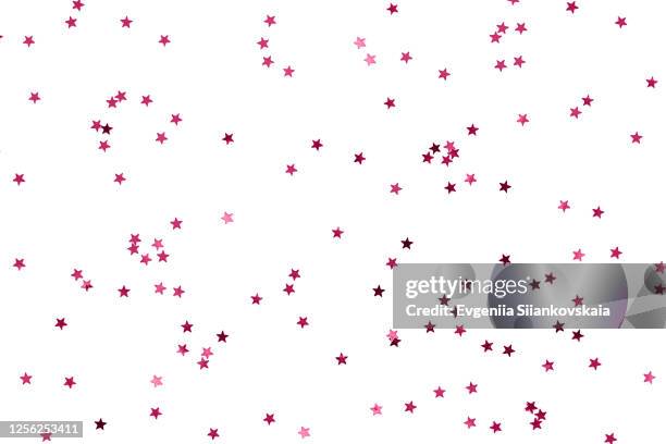 bunch of red stars on white background. - pink confetti stock pictures, royalty-free photos & images