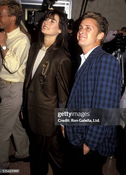 Actress Demi Moore and actor Emilio Estevez attend the "At Close Range" Westwood Premiere on April 16, 1986 at Mann Bruin Theatre in Westwood,...