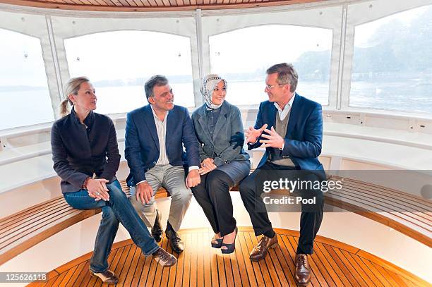 In this photo provided by the German Government Press Office, German President Christian Wulff chats with his wife Bettina , Turkey's President...