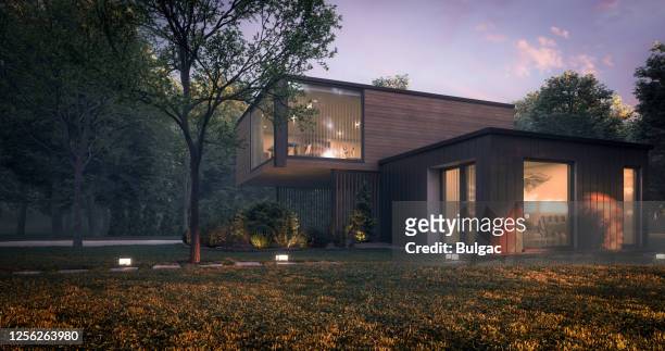 moderne minimalistische familienvilla - modern house dusk stock-fotos und bilder