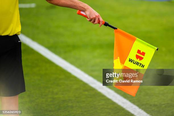 An assitant referee marks an offside with his flag during the Liga match between Levante UD and Athletic Club at Estadi Olimpic Camilo Cano on July...
