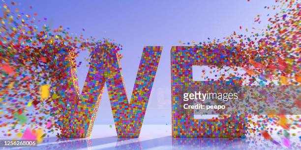 many multi-coloured square particles coming together to make word "we" - participant stock pictures, royalty-free photos & images