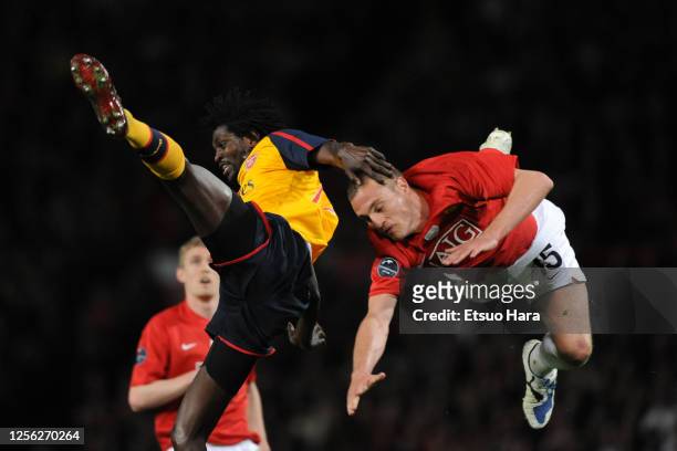 Emmanuel Adebayor of Arsenal and Nemanja Vidic of Manchester United compete for the ball during the UEFA Champions League semi final first leg match...