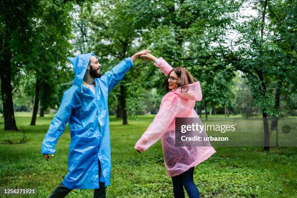 couple dancing in the rainy day - dancing in the rain stock pictures, royalty-free photos & images