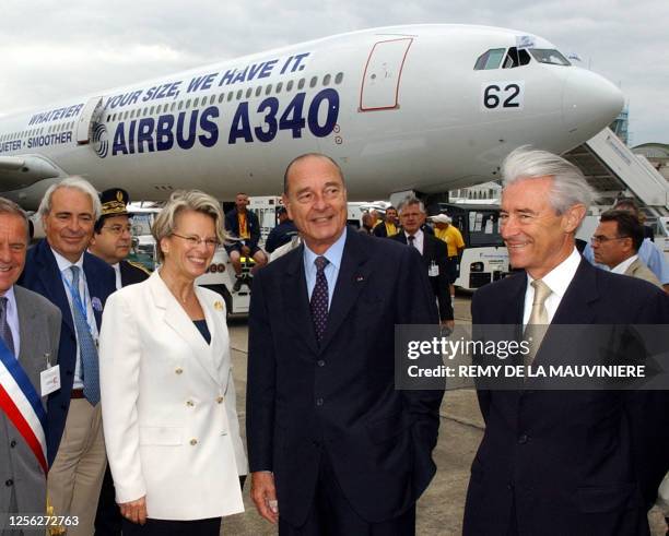 French President Jacques Chirac with at his sides French transport minister Gilles de Robien, right, and French defense ministrer Michel...