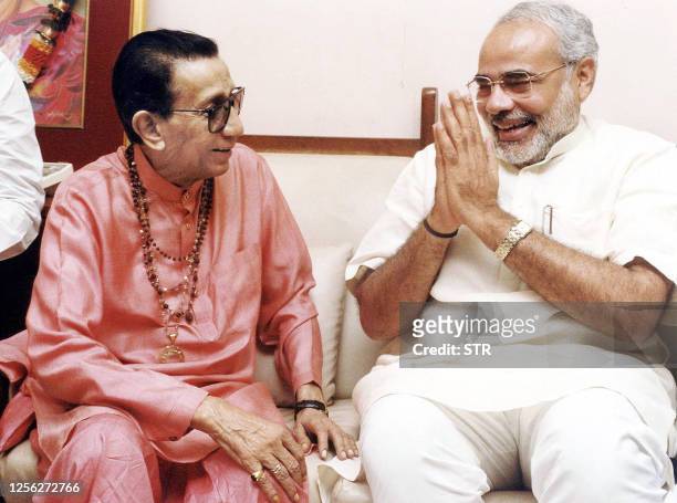 Gujarat state Chief Minister Narendra Modi greets rightwing Hindu party Shiv Sena chief Bal Thackeray at the latter's residence 20 March, 2003 in...
