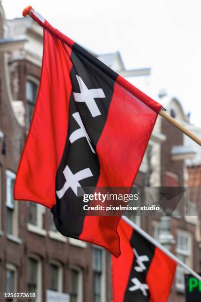 flag of municipality of amsterdam - pole stock pictures, royalty-free photos & images