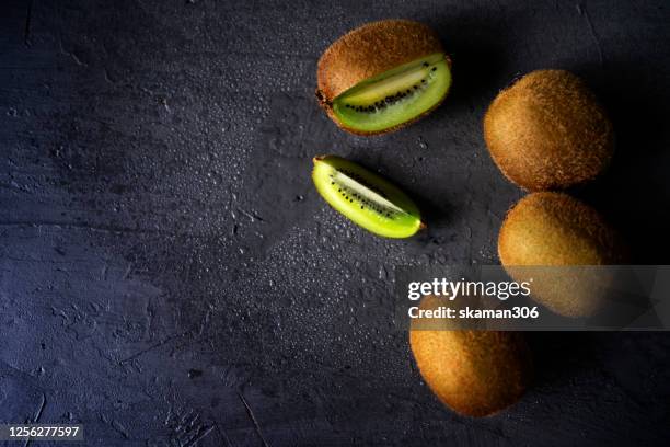 closeup groups of fresh kiwi and lime fruit kiwi and lime is acid and sour taste with copyspace - neuseeländische kultur stock-fotos und bilder