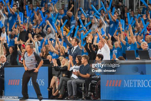 spectators cheering in stadium - basketball fans stock pictures, royalty-free photos & images