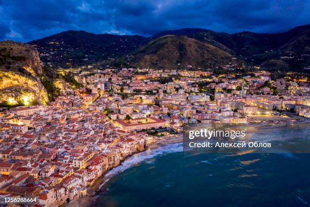 panorama view on night cityscape of cefalu from the sea. tyrrhenian sea. sicily, italy - abruzzo stock pictures, royalty-free photos & images