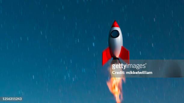 small space ship launches and flys towards the stars at night - first space shuttle launch stock pictures, royalty-free photos & images