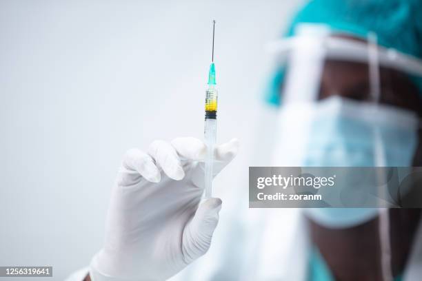 Hand Using A Syringe Push Syringes Photos and Premium High Res Pictures - Getty Images