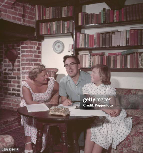 English actor Eric Barker at home with his wife, actress Pearl Hackney and daughter Petronella at home in Kent, England in 1955.