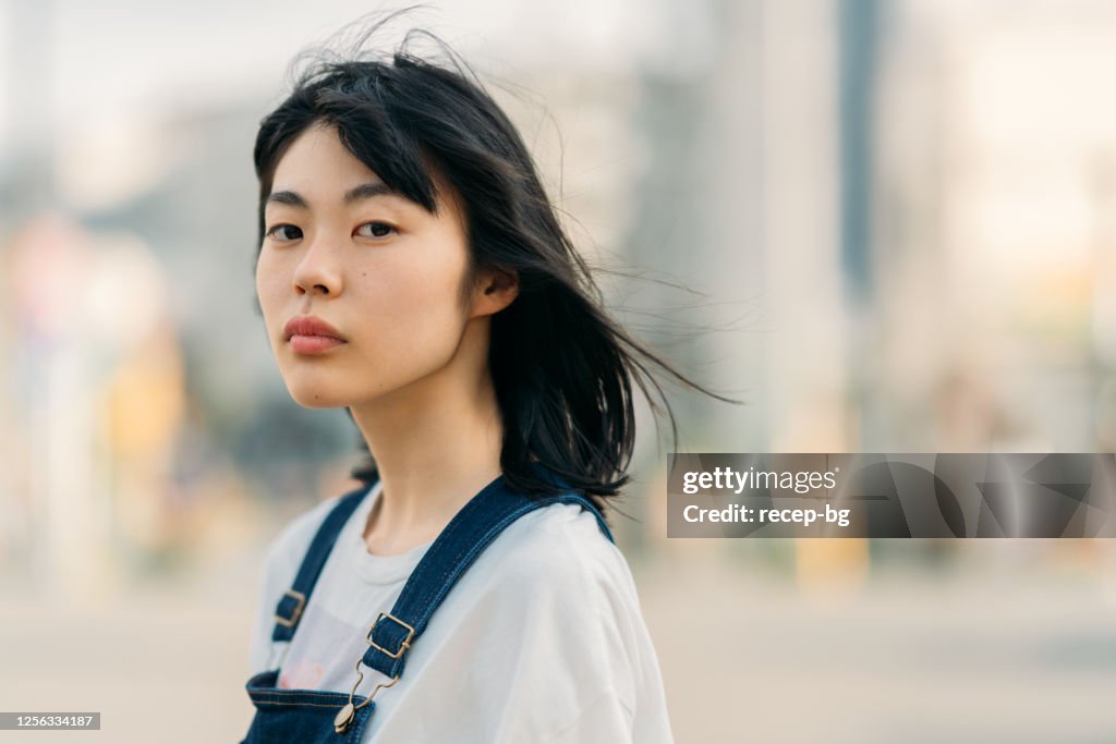 Portrait of young woman on windy day