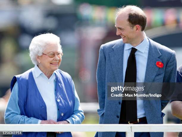 Queen Elizabeth II watches her horse 'Barber's Shop' compete in the Tattersalls and Ror Thoroughbred Ridden Show Class on day 3 of the Royal Windsor...