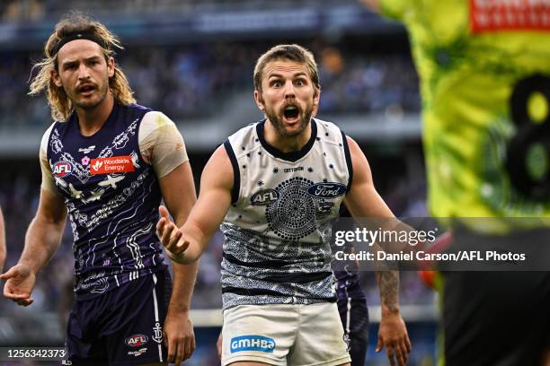 Tom Atkins of the Cats remonstrates with the umpire during the 2023 AFL Round 10 match between Walyalup/Fremantle Dockers and the Geelong Cats at...