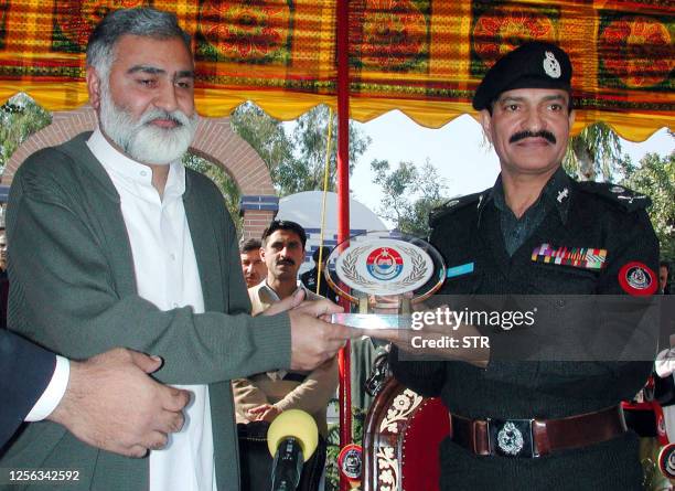 An undated picture shows Saeed Khan , Inspector General of police in North West Frontier Province and NWFP Chief Minister Akram Durrani posing for...