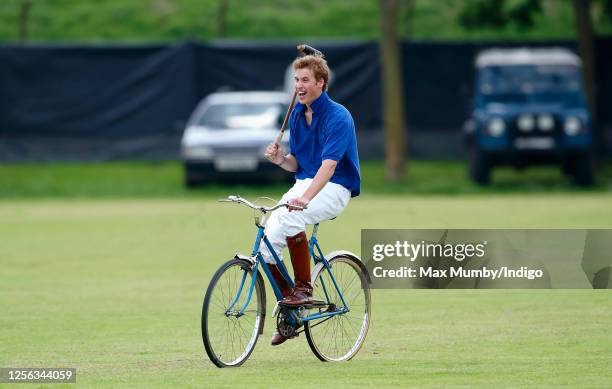 Prince William takes part in a charity Jockeys v Eventers bicycle polo match at Tidworth Polo Club on July 13, 2002 in Tidworth, England.